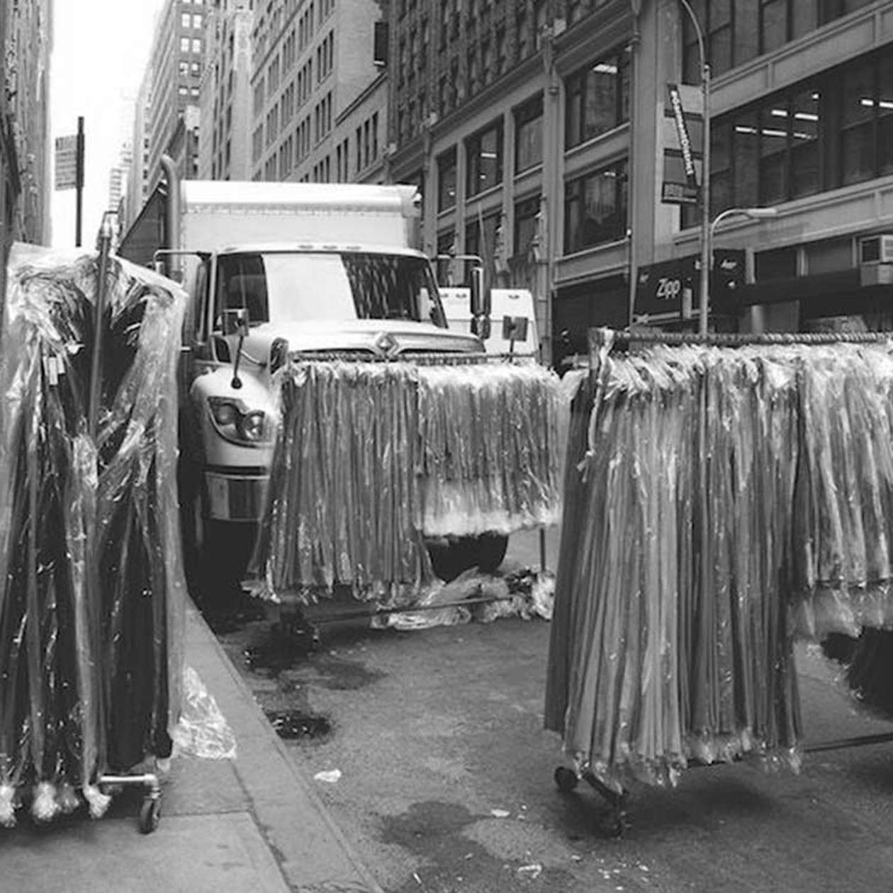 racks of clothes on the street in New York City's Garment District