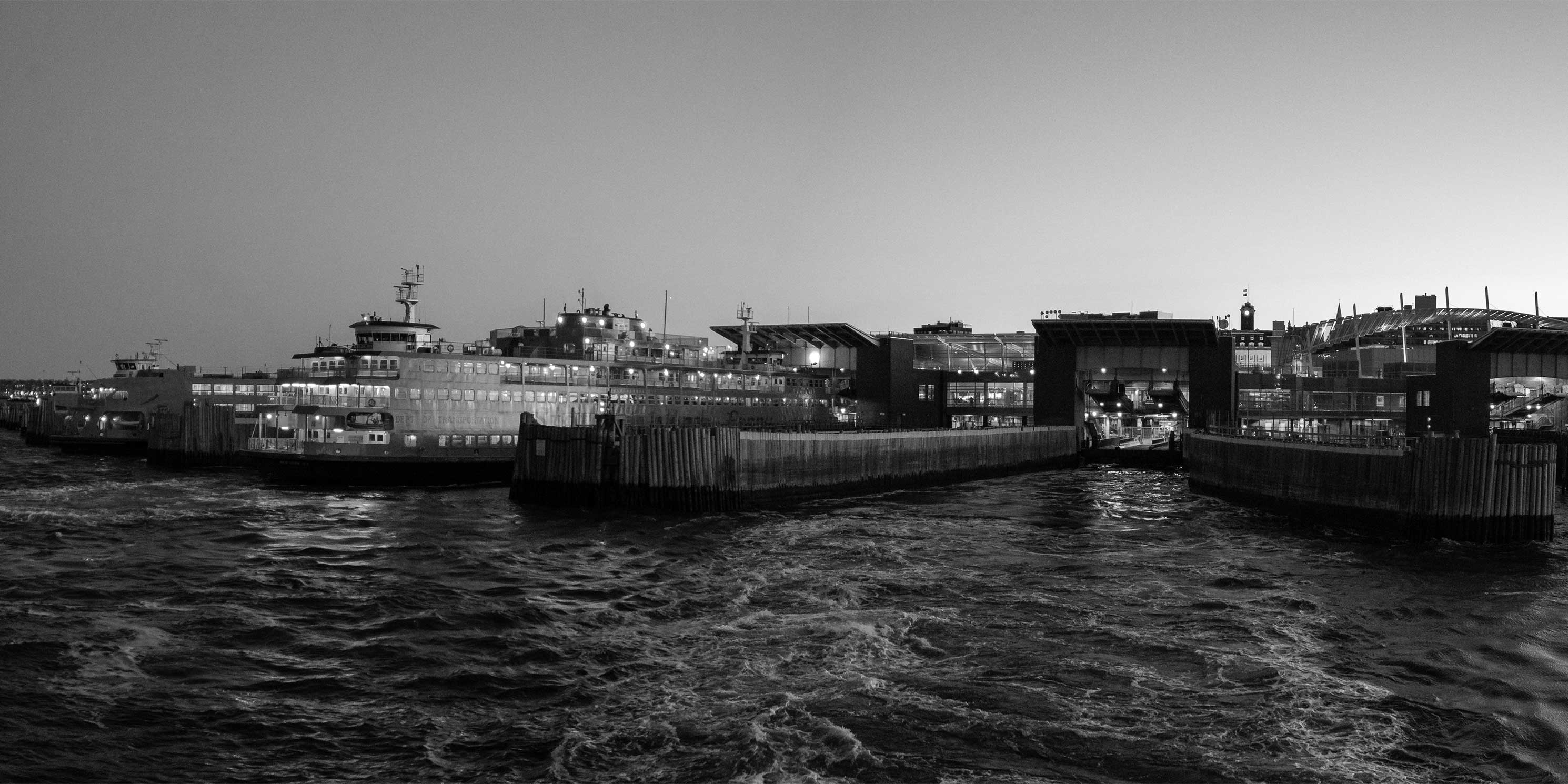 Panorama of the Staten Island Ferry Terminal at sunset. Photo: Wikimedia Commons, Eric Kilby.