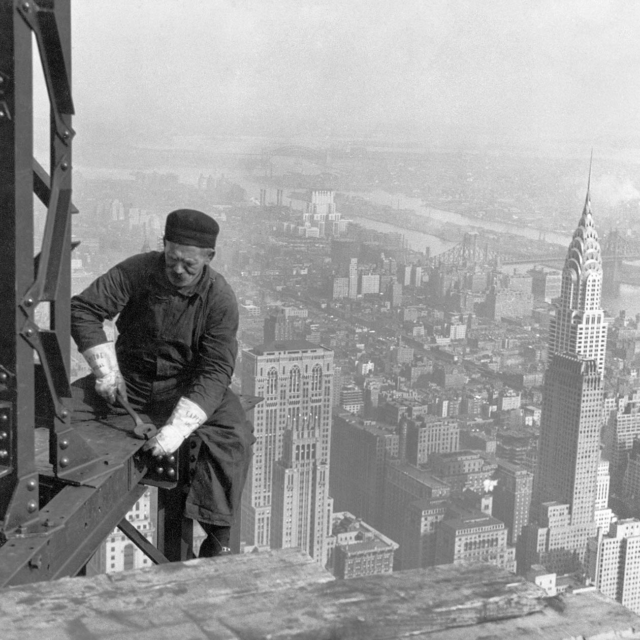 archival photo, steelworker on beam, builds skyscraper