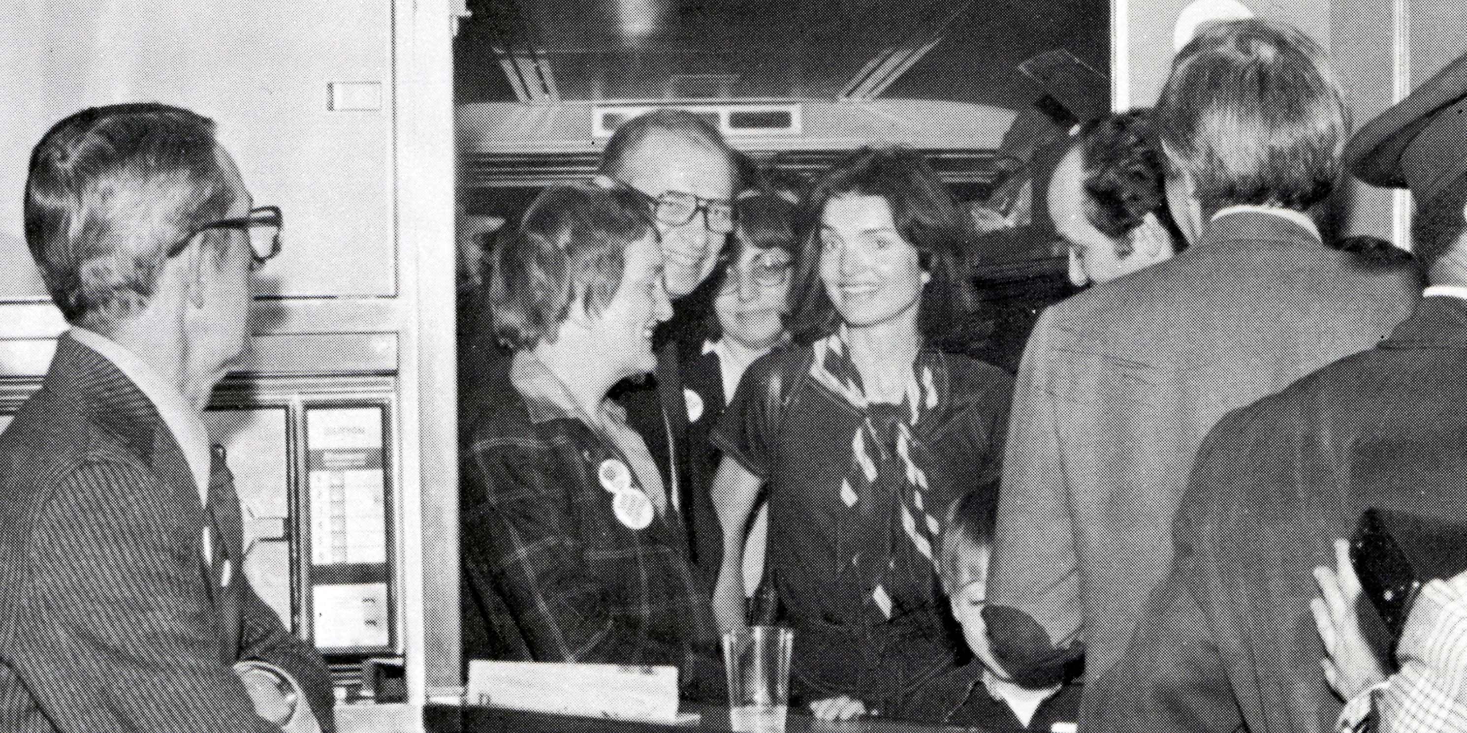 Jacqueline Kennedy Onassis on train with supporters