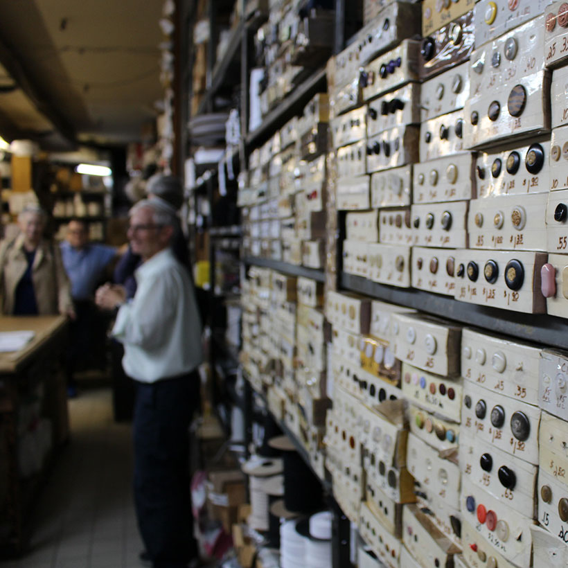 buttons on display wall at Garment District shop