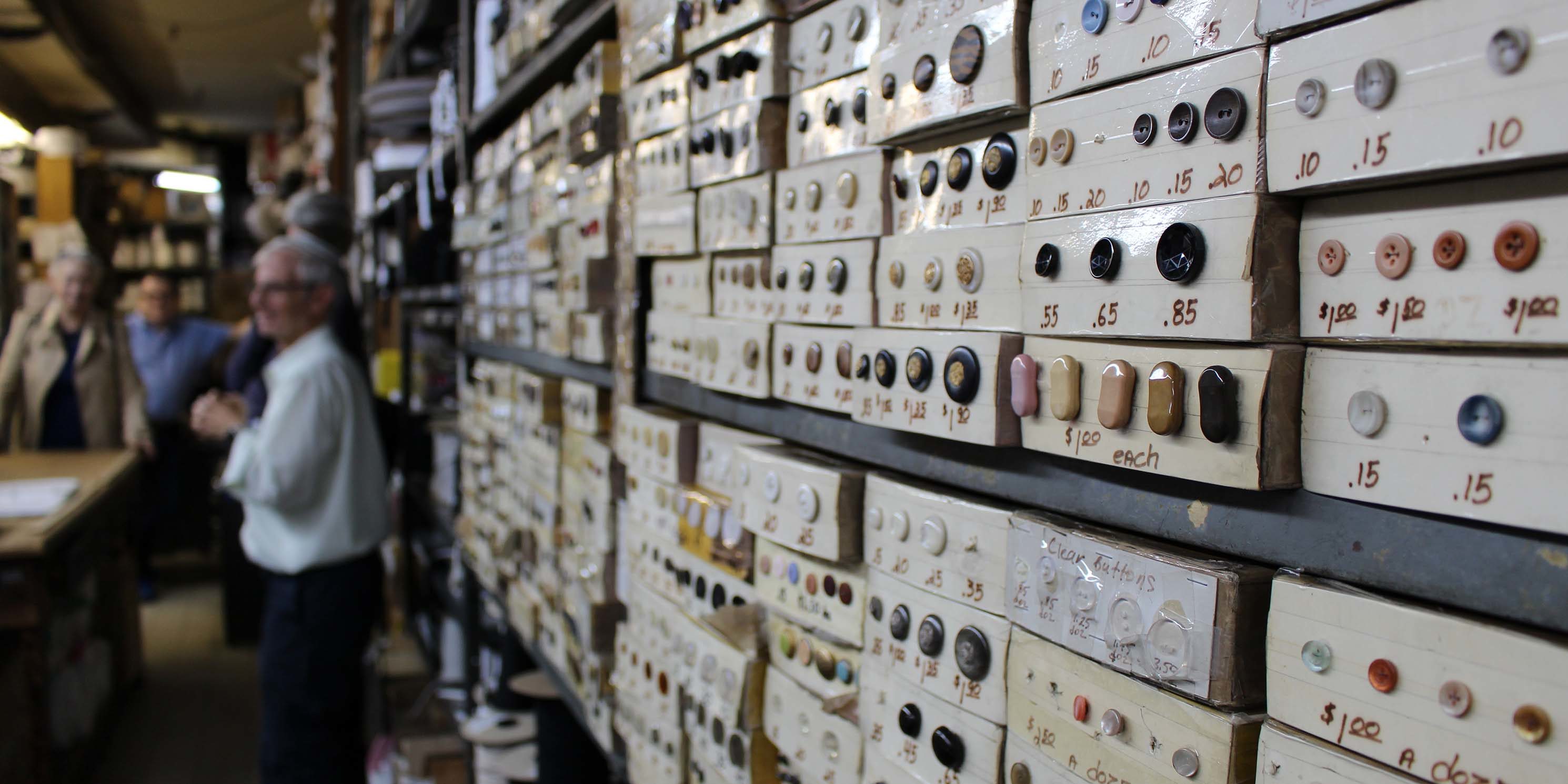 buttons on display wall at Garment District shop