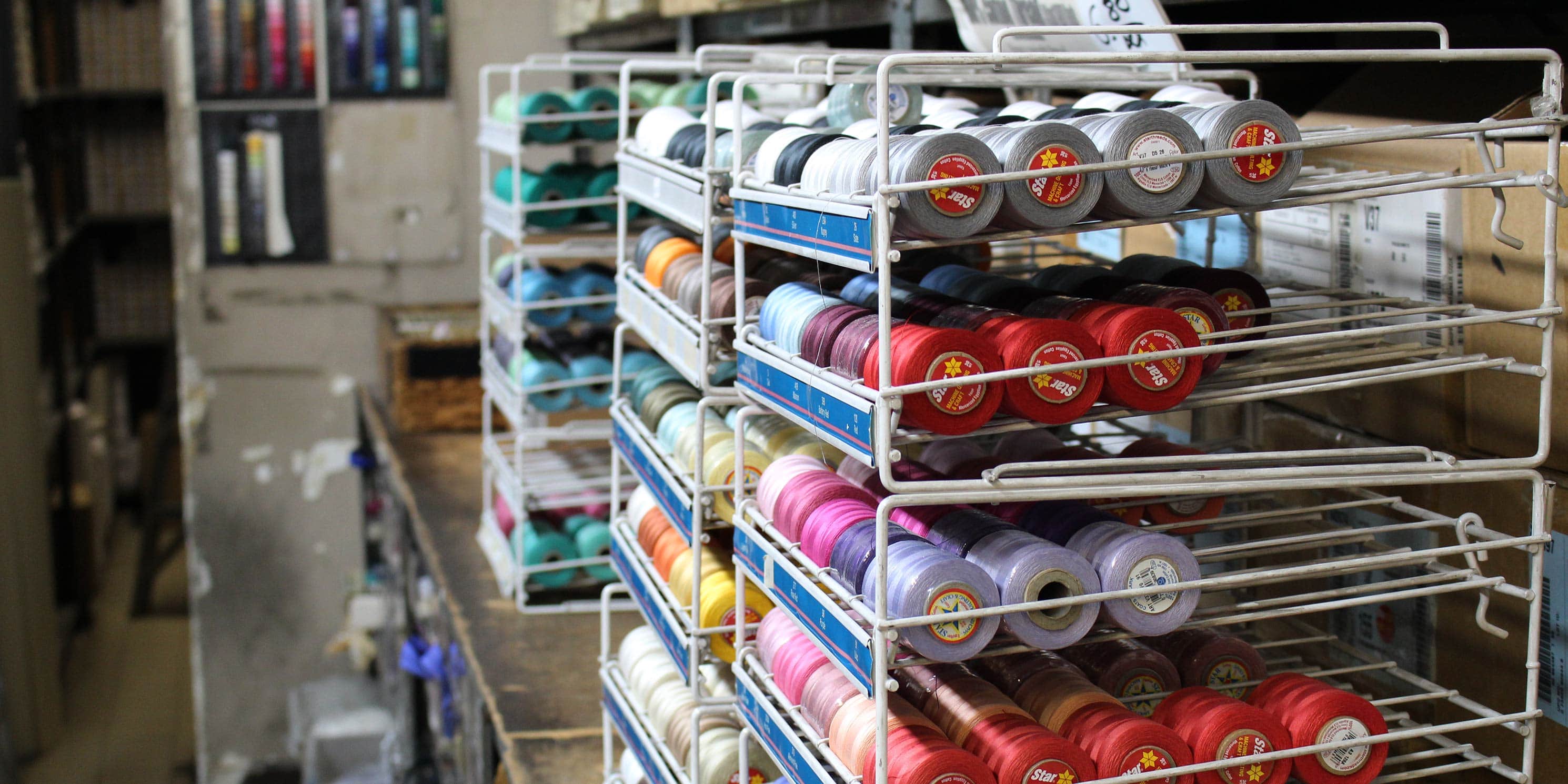 spools of thread on racks in Garment District shop