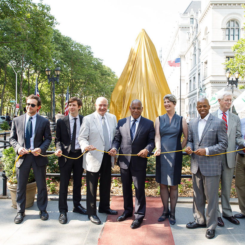 leaders hold ribbon at Henry Ward Beecher Monument Dedication