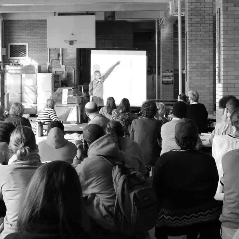 speaker and audience at workshop