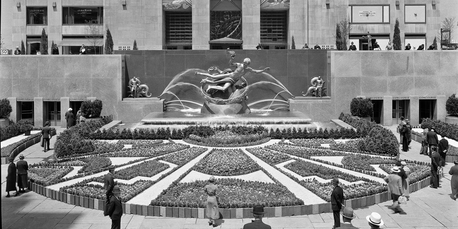 people gaze at the fountain in Rockefeller Center