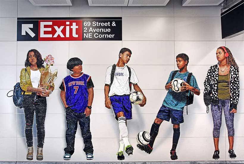 a glass mural in a subway station
