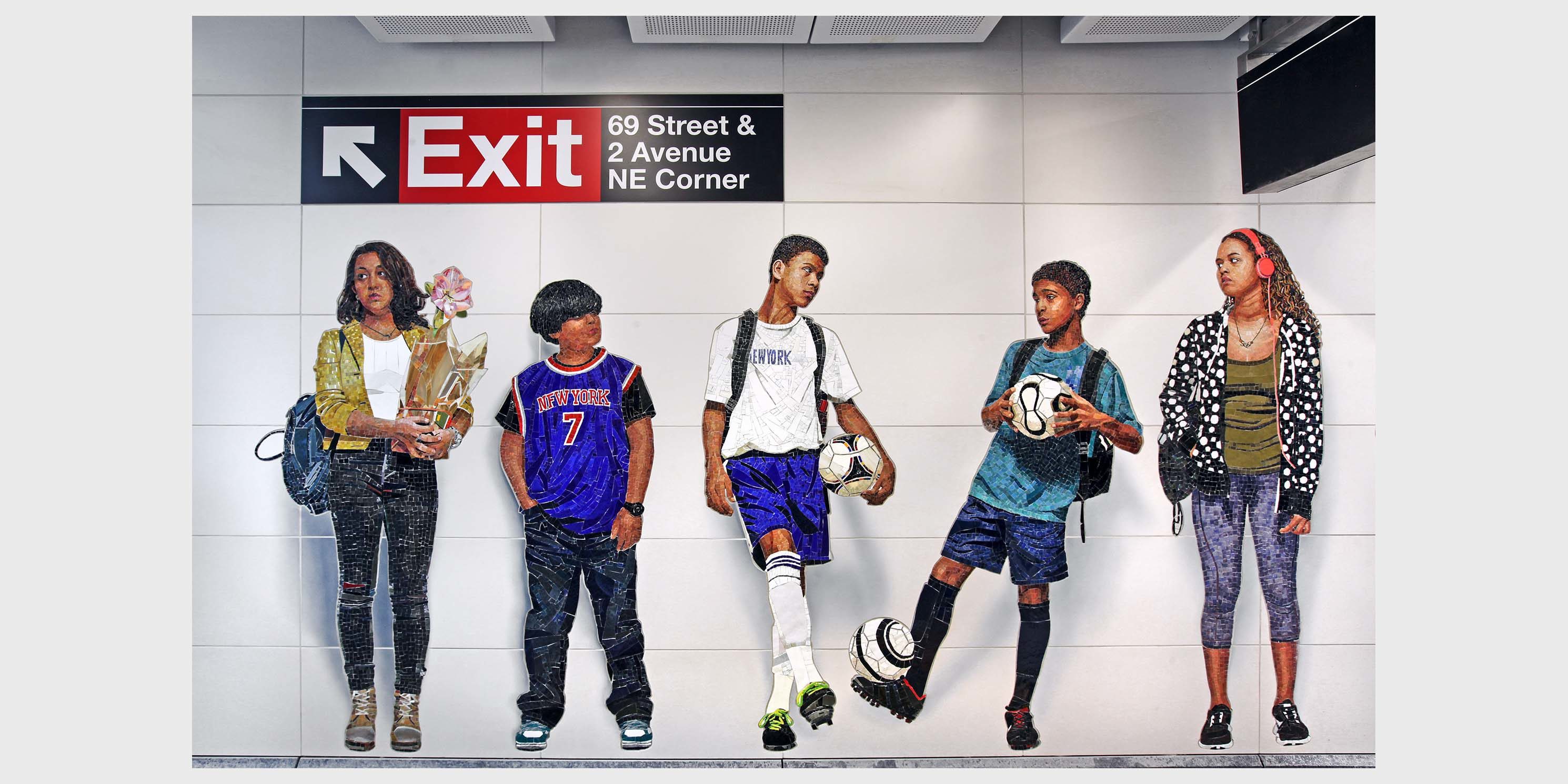 a glass mural in a subway station