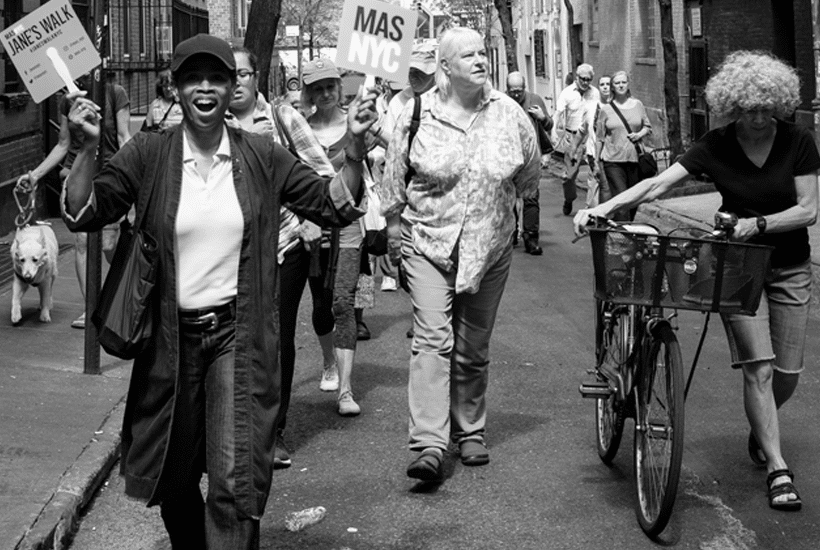 a leader and walkers on a Jane's Walk in Greenwich Village