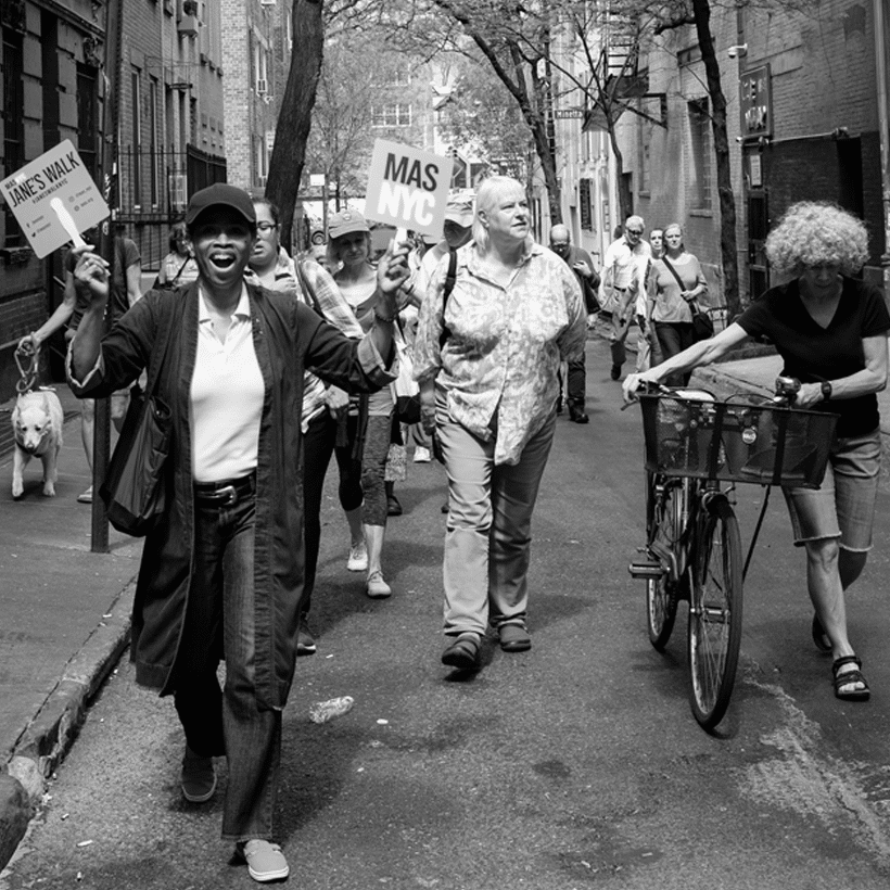 a leader and walkers on a Jane's Walk in Greenwich Village