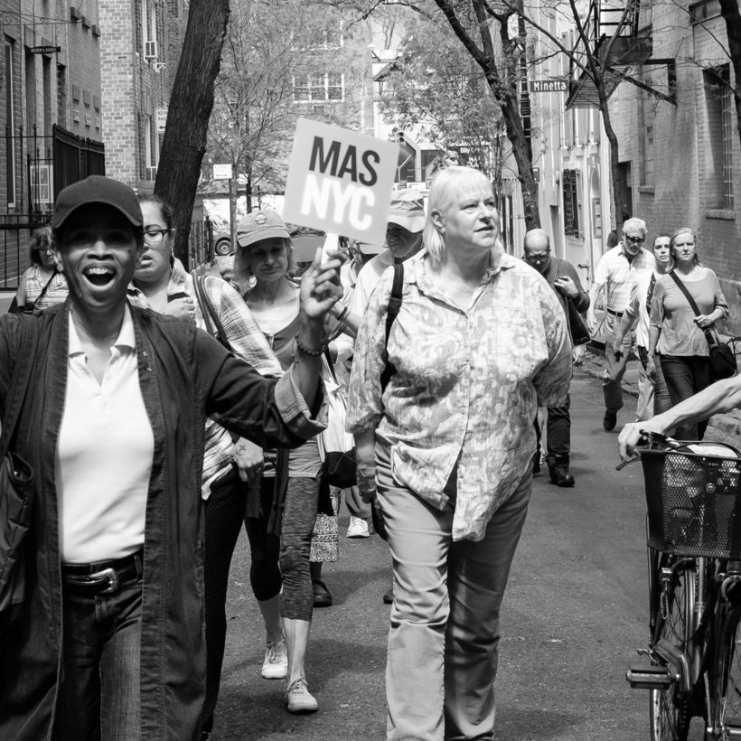 a leader and walkers on a Jane's Walk in Greenwich Village