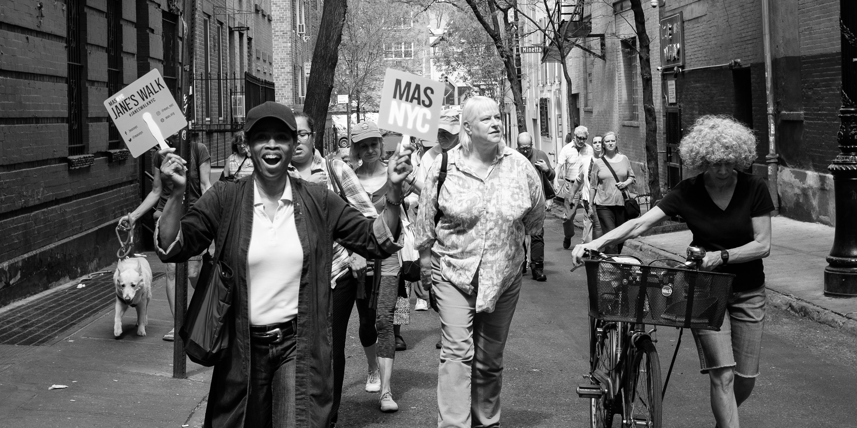 a leader and walkers on a Jane's Walk in Greenwich Village