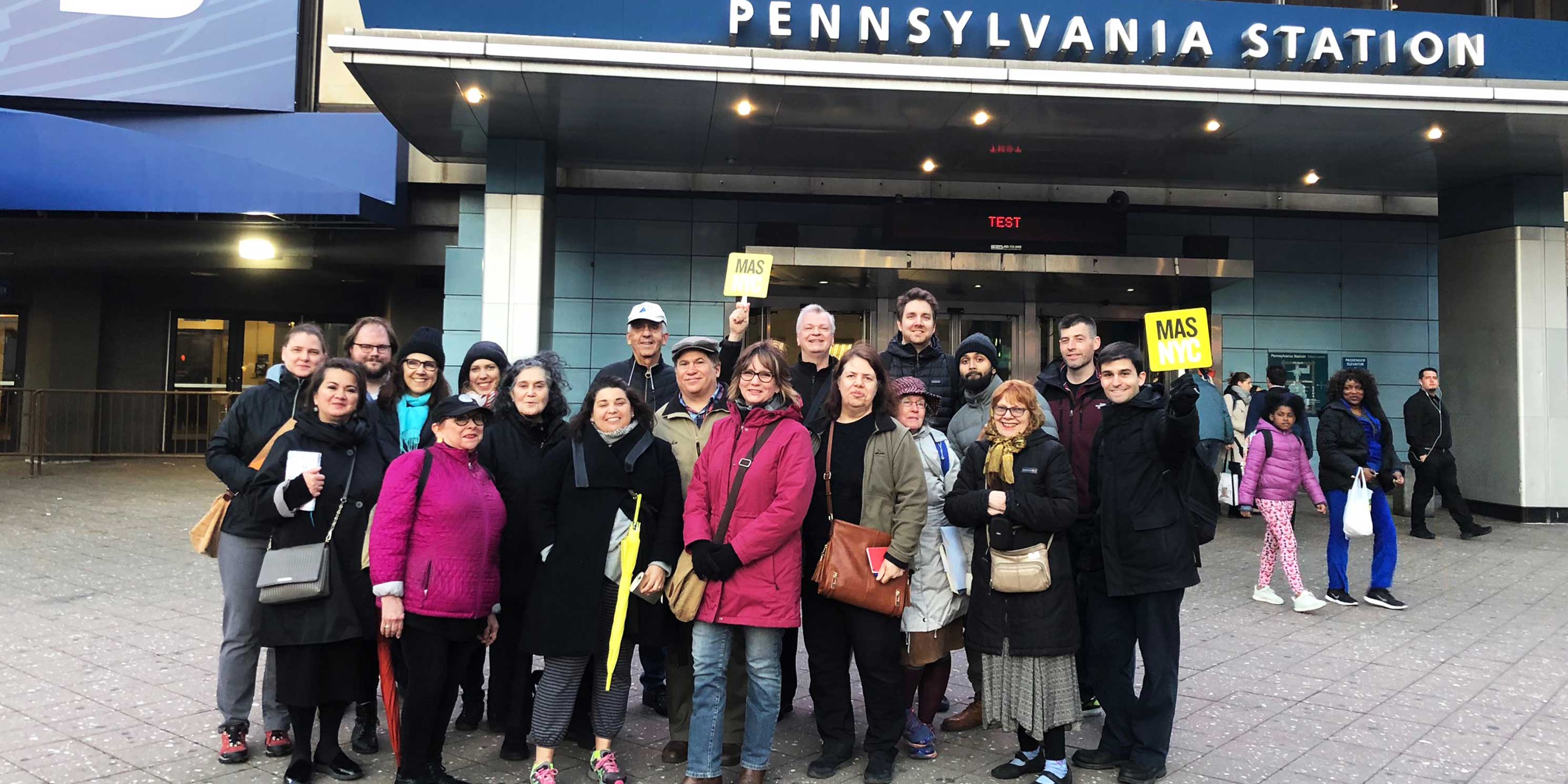 people on a Jane's Walk training tour outside Penn Station