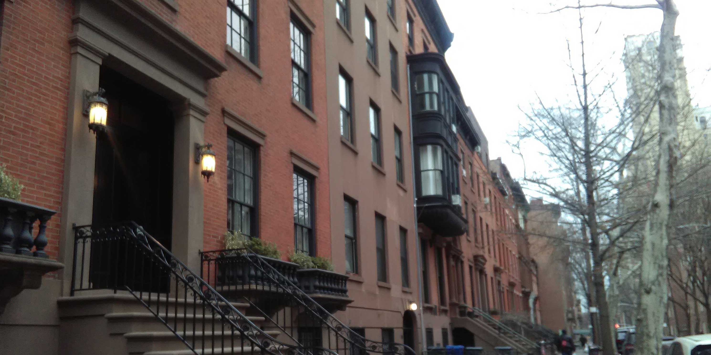 row of brownstone buildings in New York City