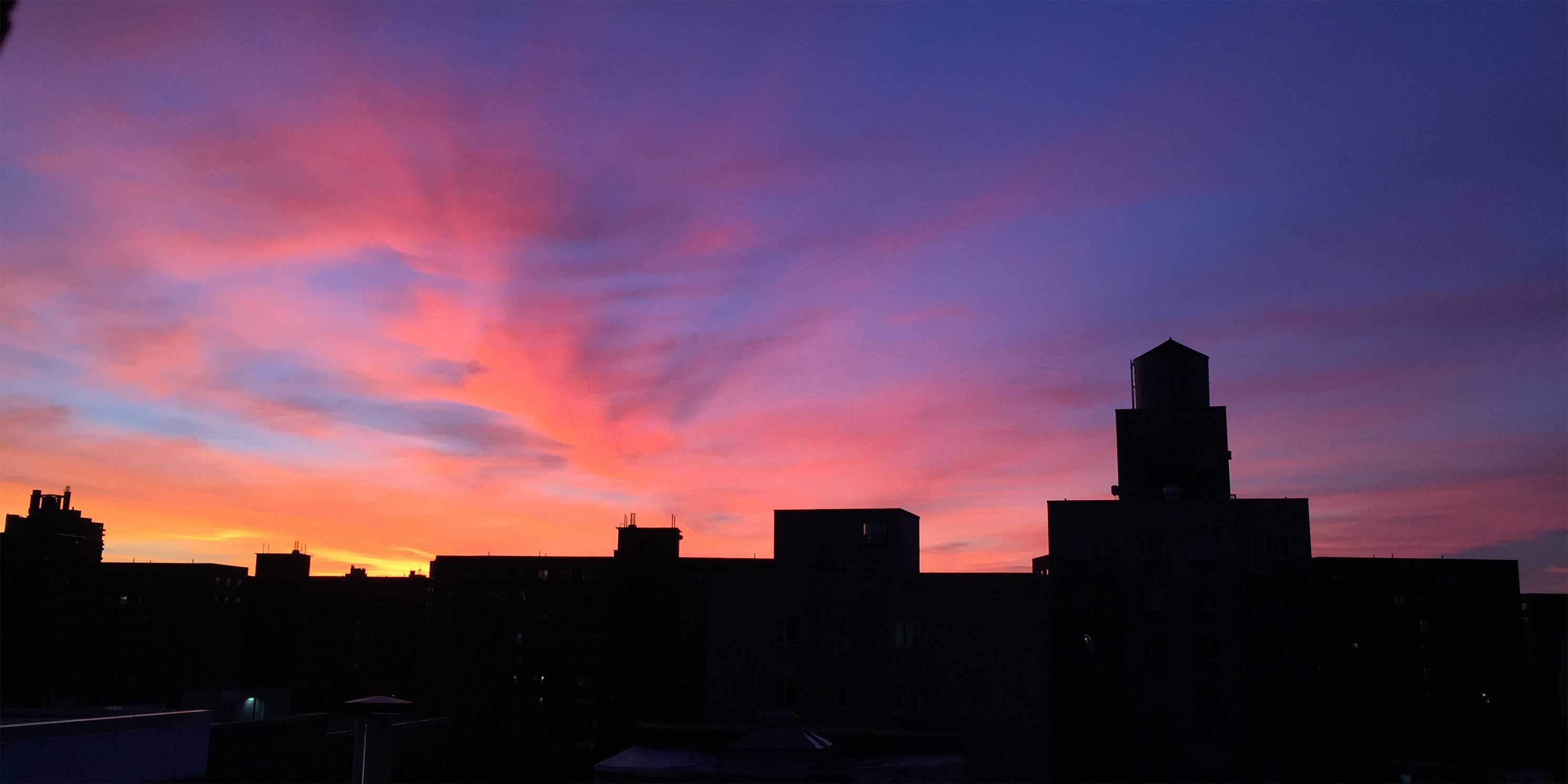 Sunset over buildings in East Harlem