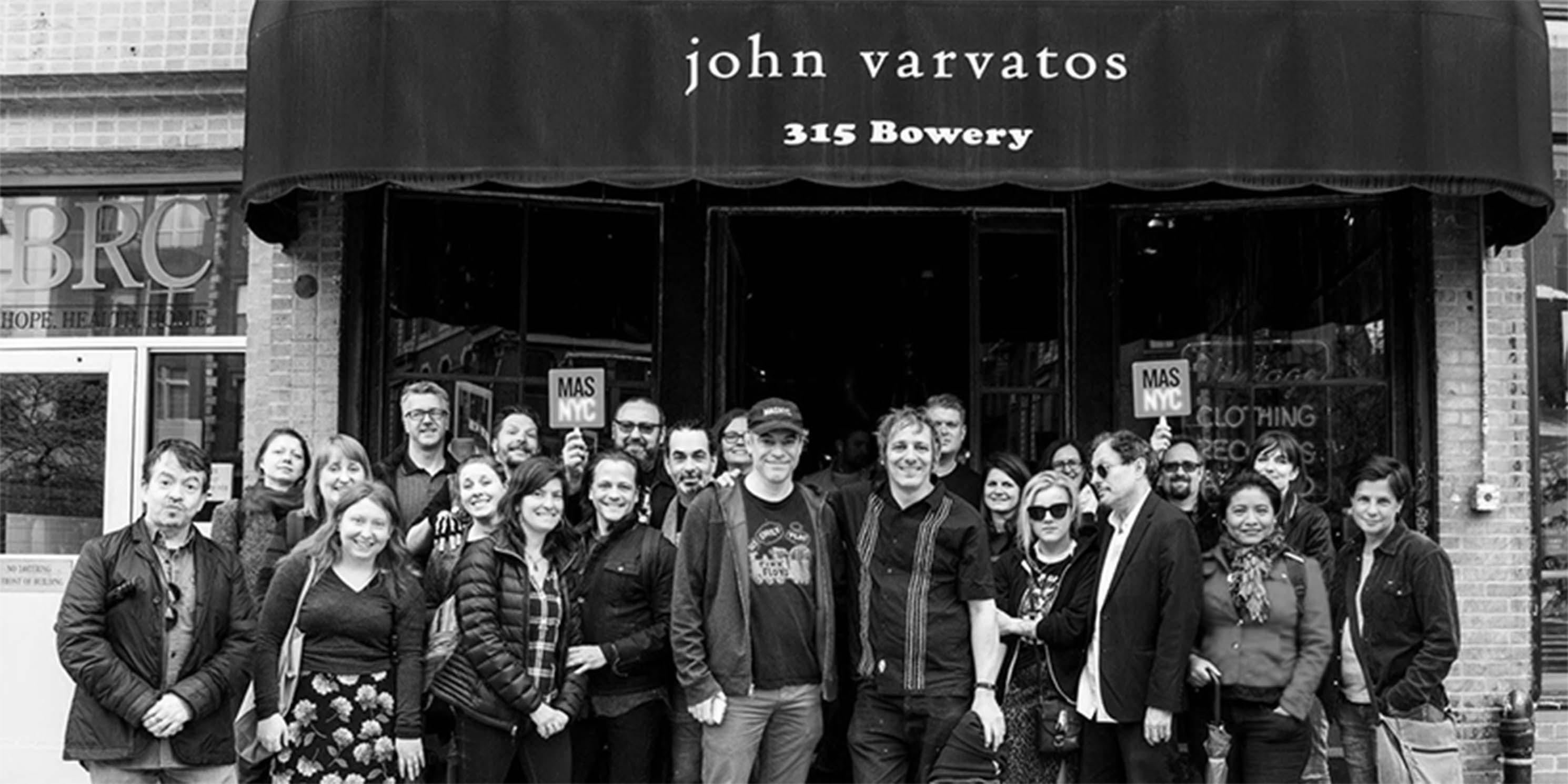 Jane's Walk attendees pose for group photo at the former site of CBGBs