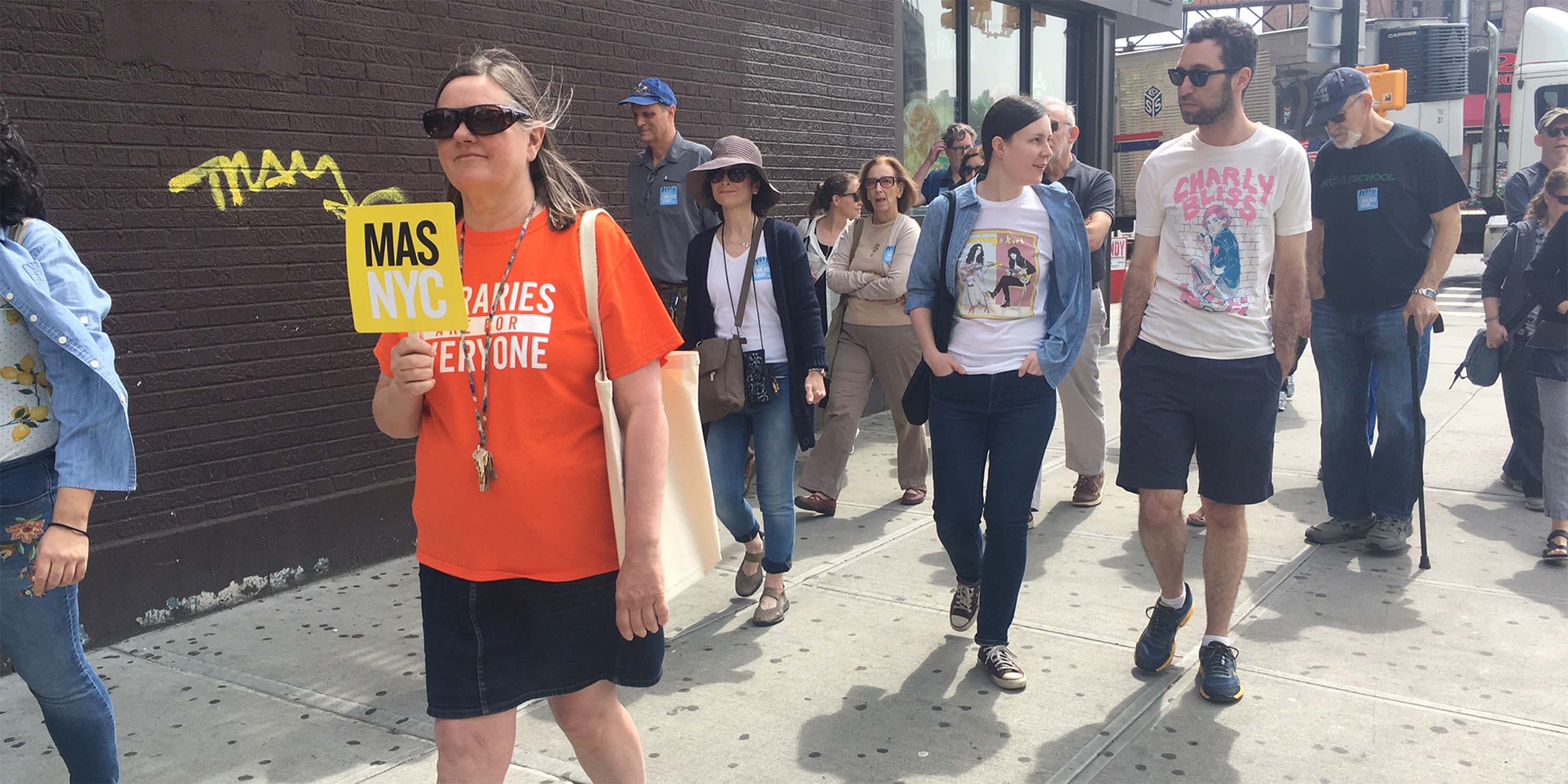 Jane's Walk participants walking a street in Inwood