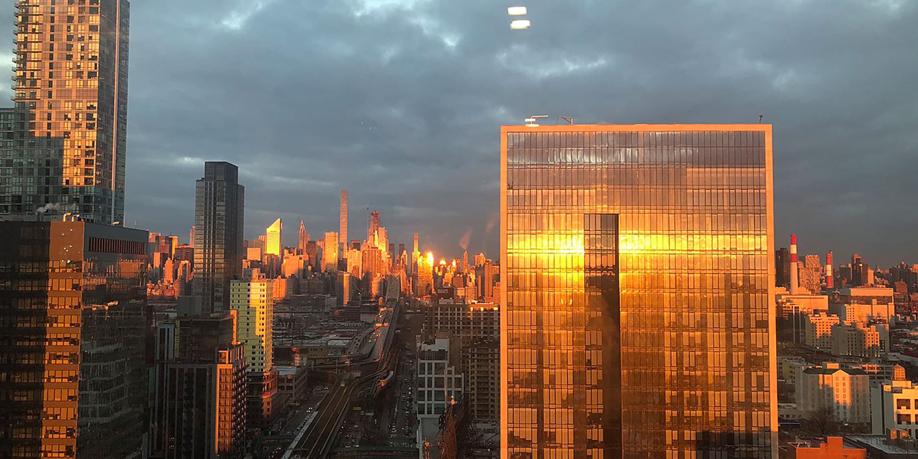 sun reflects off buildings in Long Island City