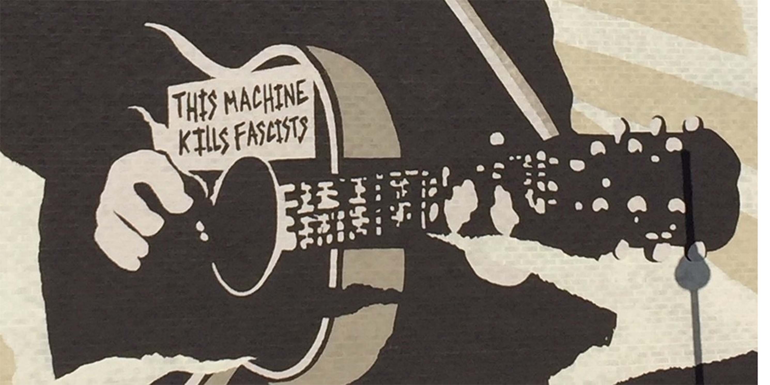 mural of Woody Guthrie playing guitar