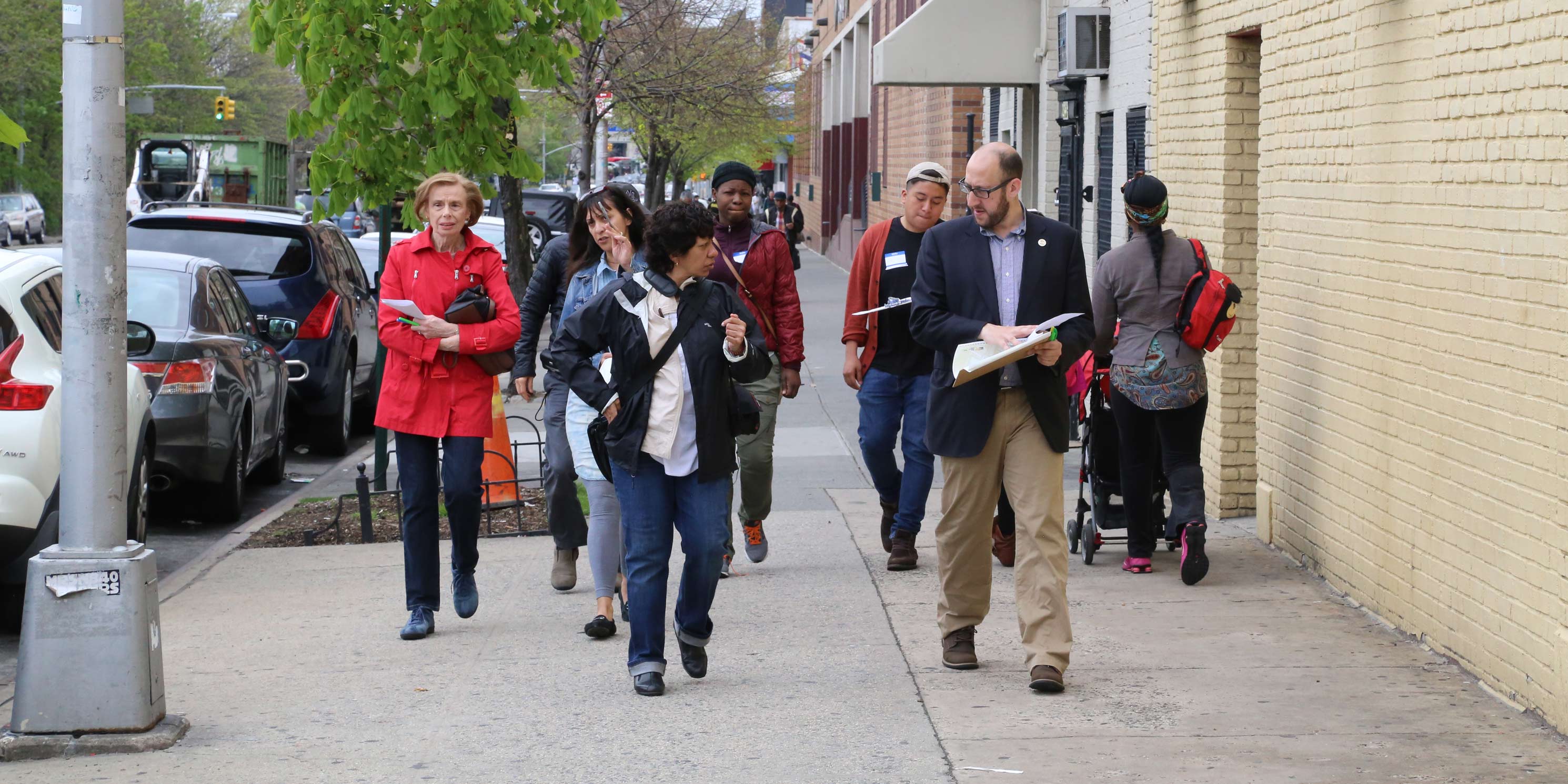 workshop participants walk down sidewalk