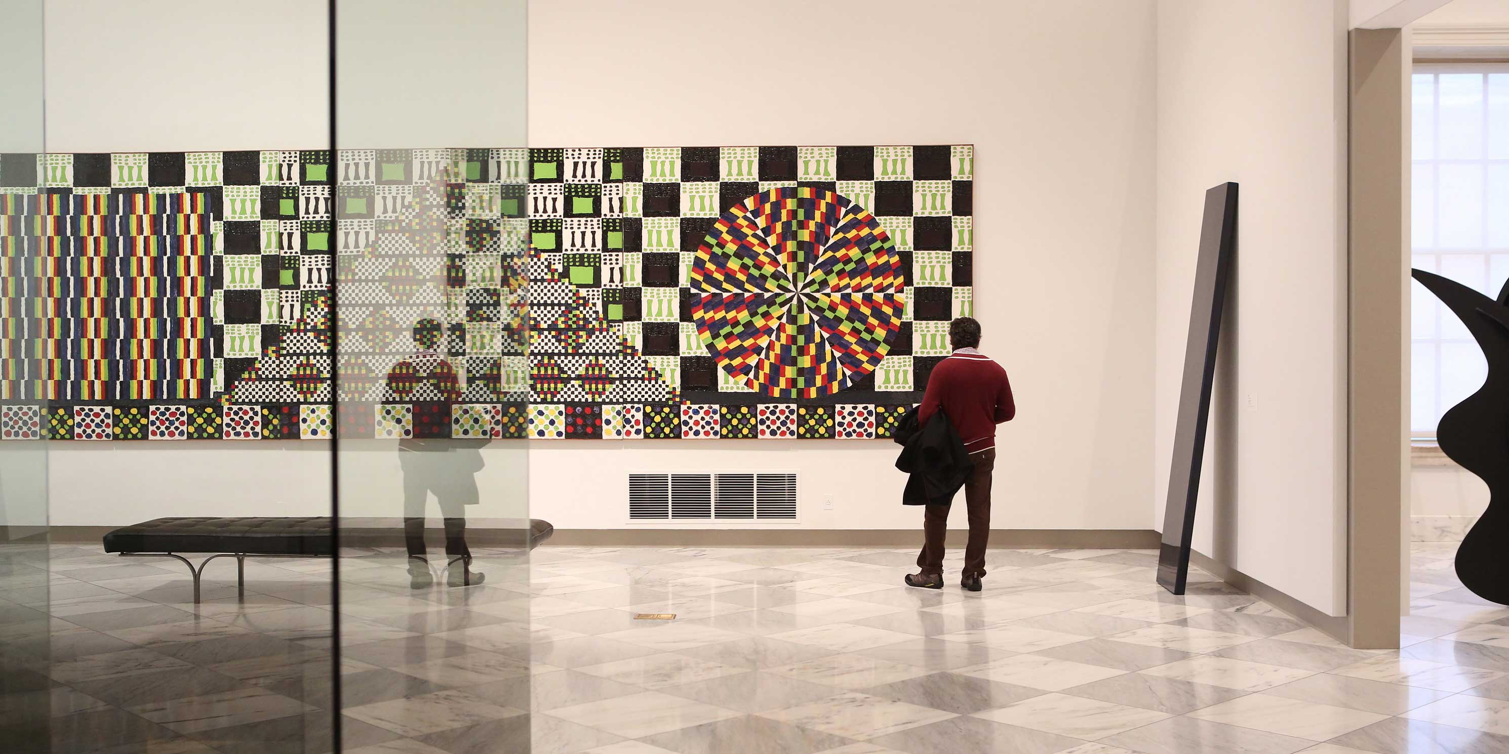 man views painting at the Smithsonian American Art Museum