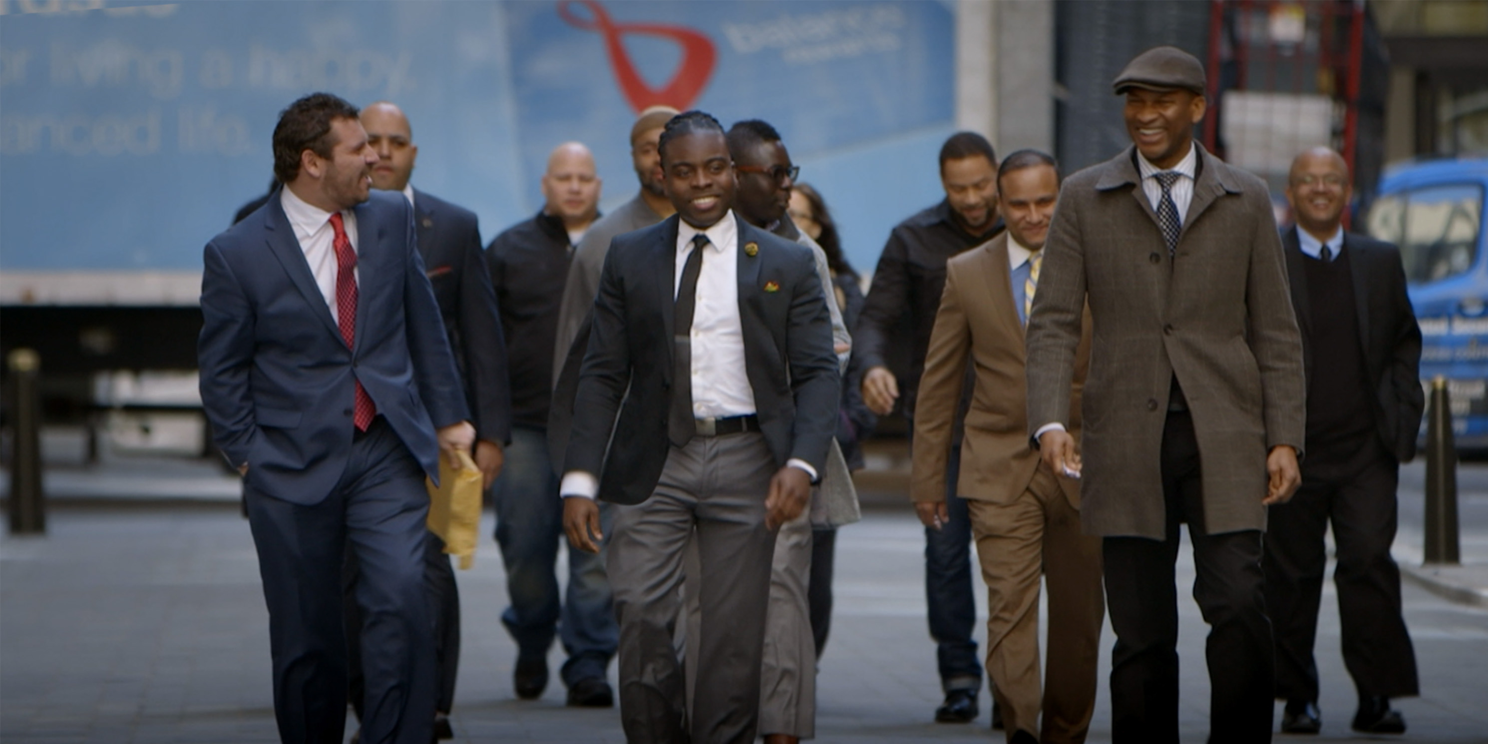 still from the movie Crime and Punishment, characters walk in a group