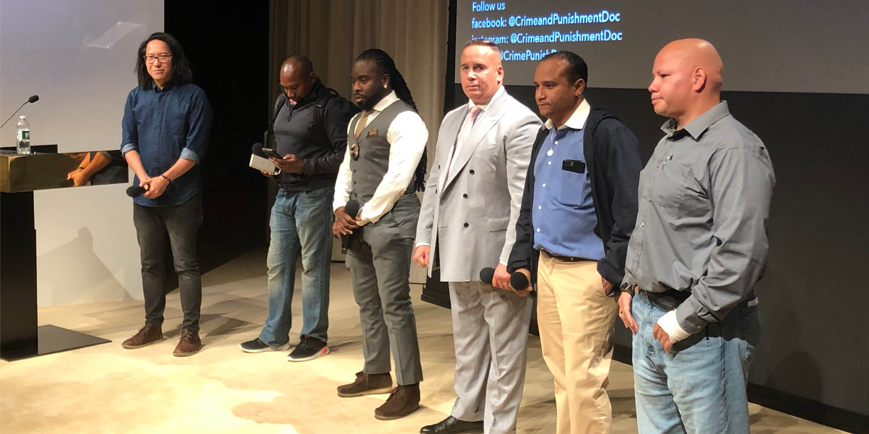 director and cast members on stage during a screening of the movie Crime and Punishment