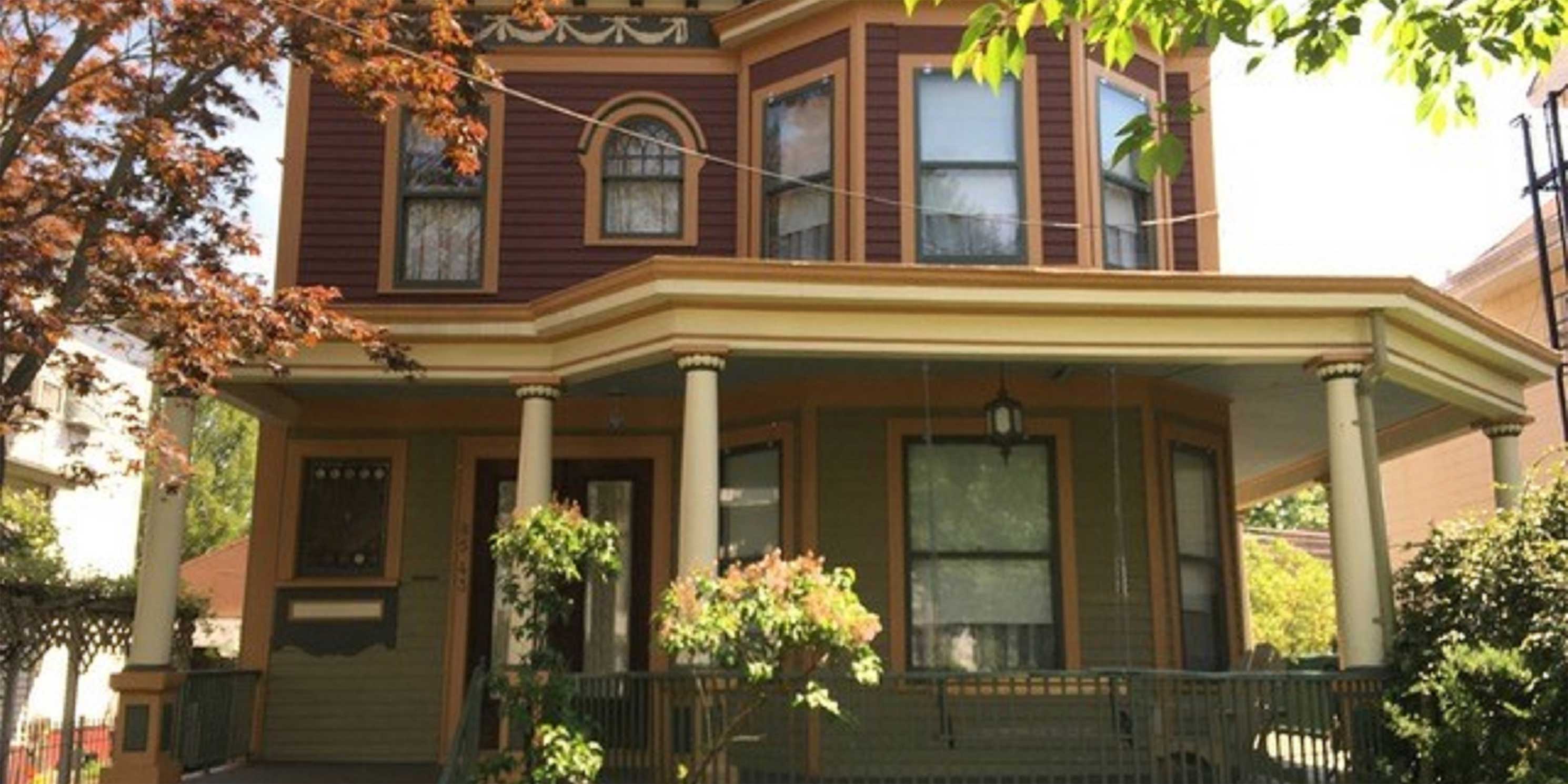 wooden home with porch in Richmond Hill, Queens