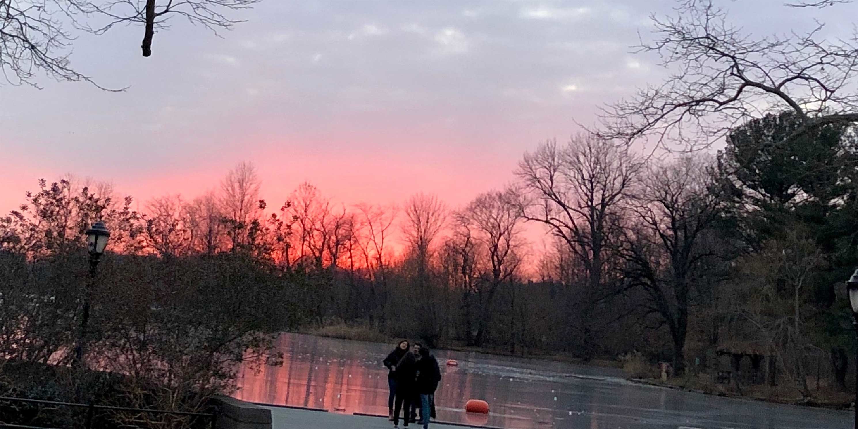 people enjoy a winter sunset in Prospect Park