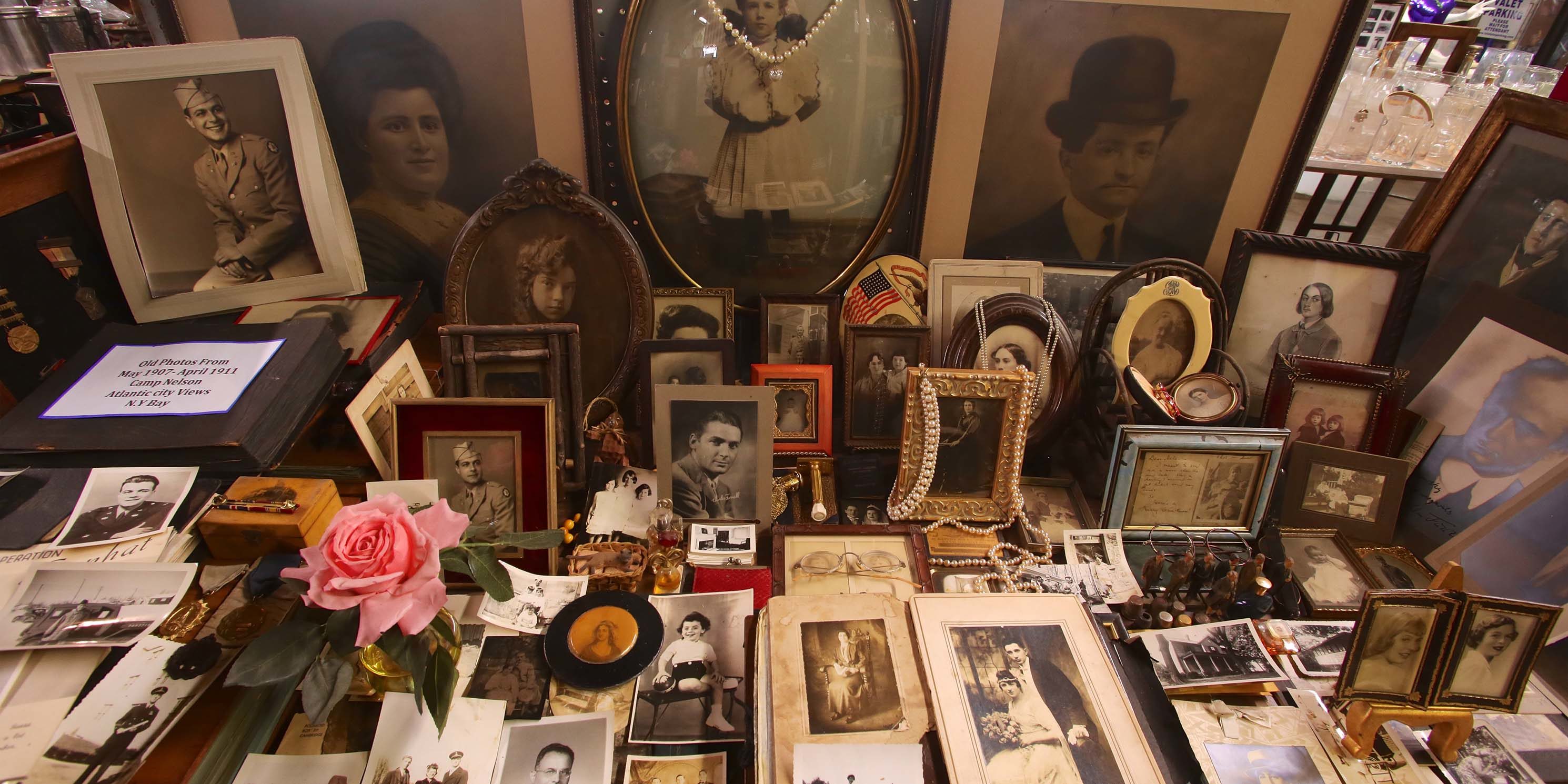 vintage portraits on a table at Treasures in the Trash