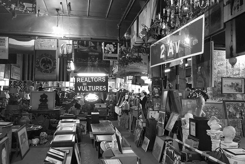 room filled with paintings and signs at Treasures in the Trash