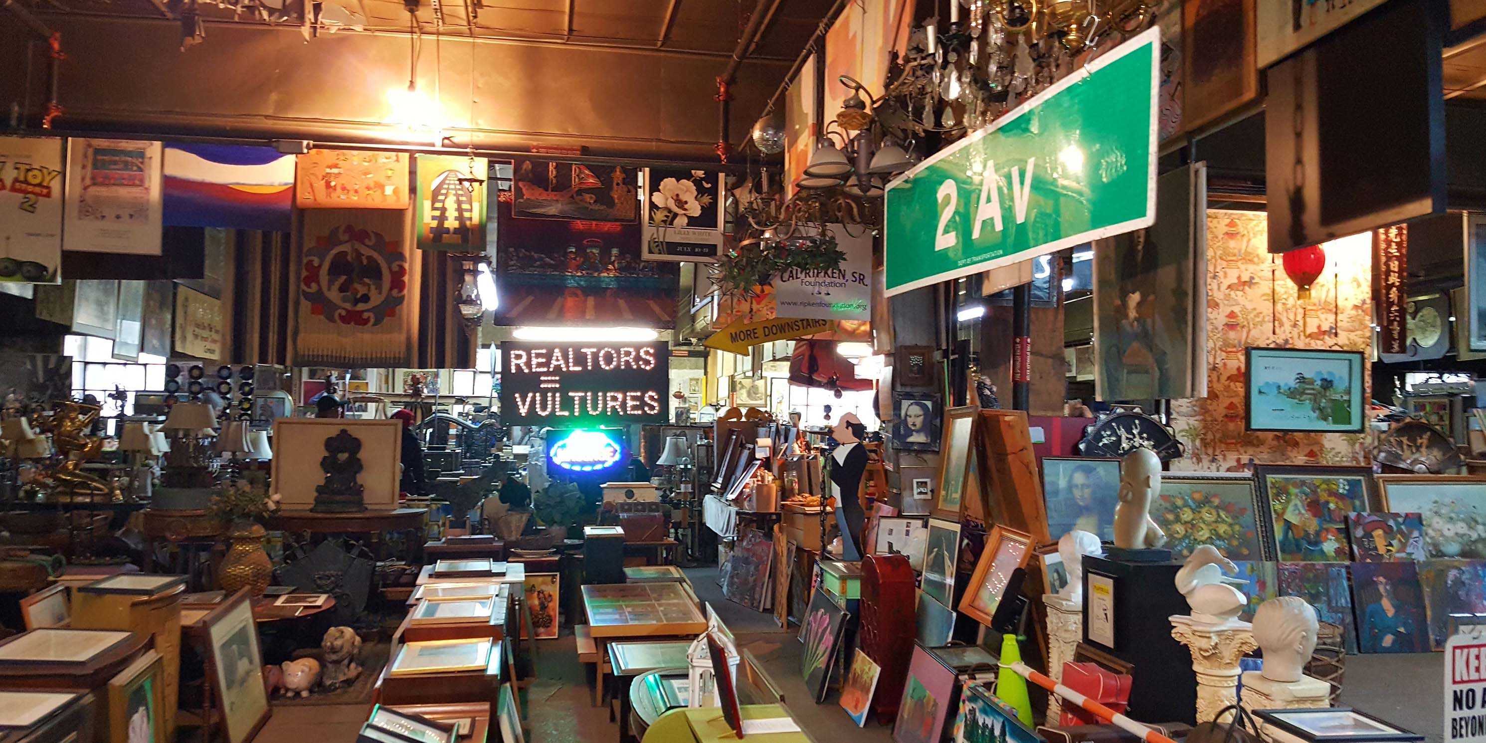 room filled with paintings and signs at Treasures in the Trash