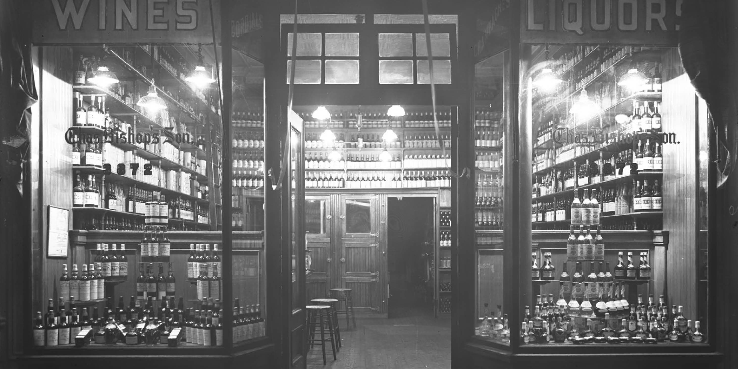 archival photo of a wine and liquor store's front windows