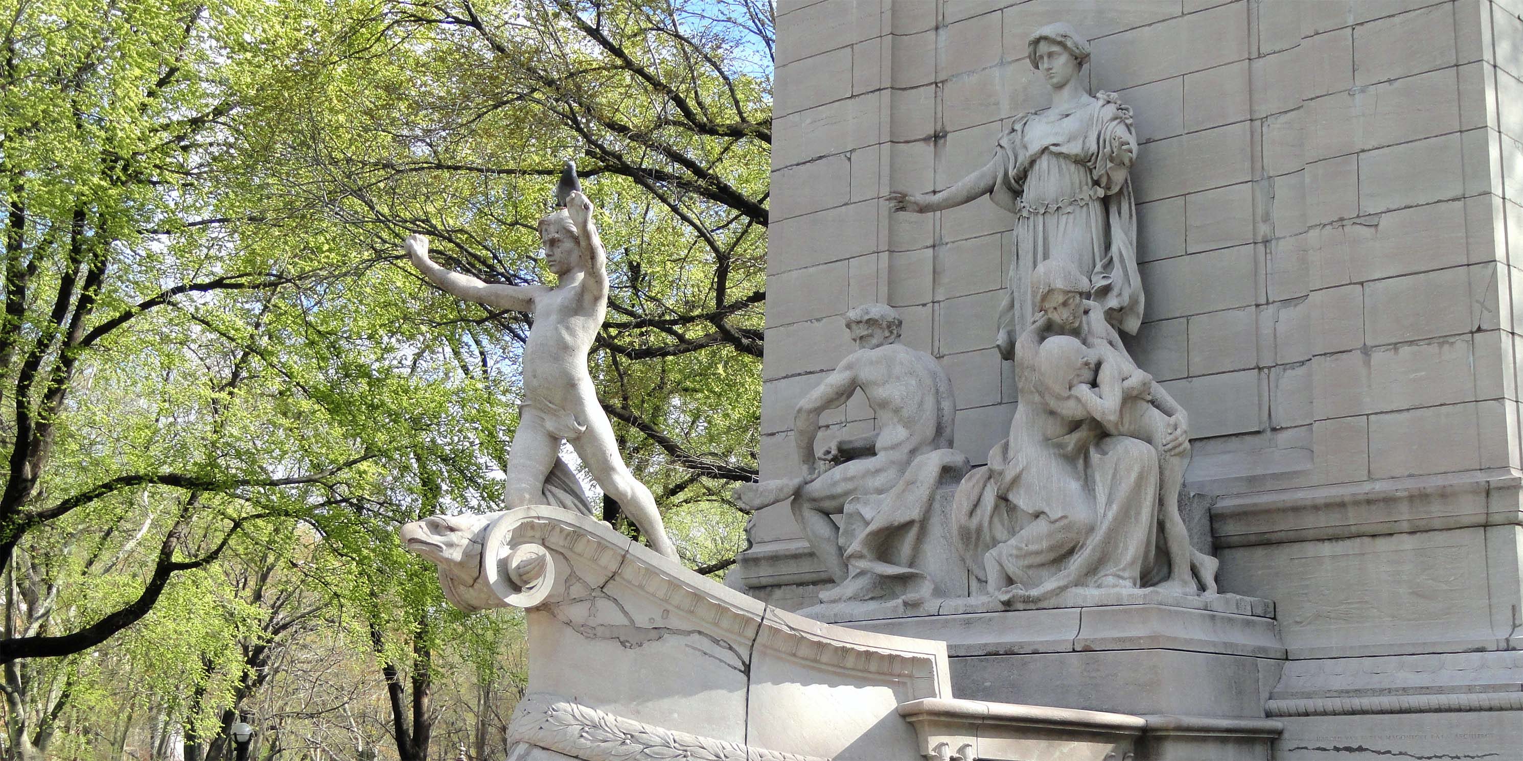 USS Maine National Monument featuring stone figures on the bow of a ship