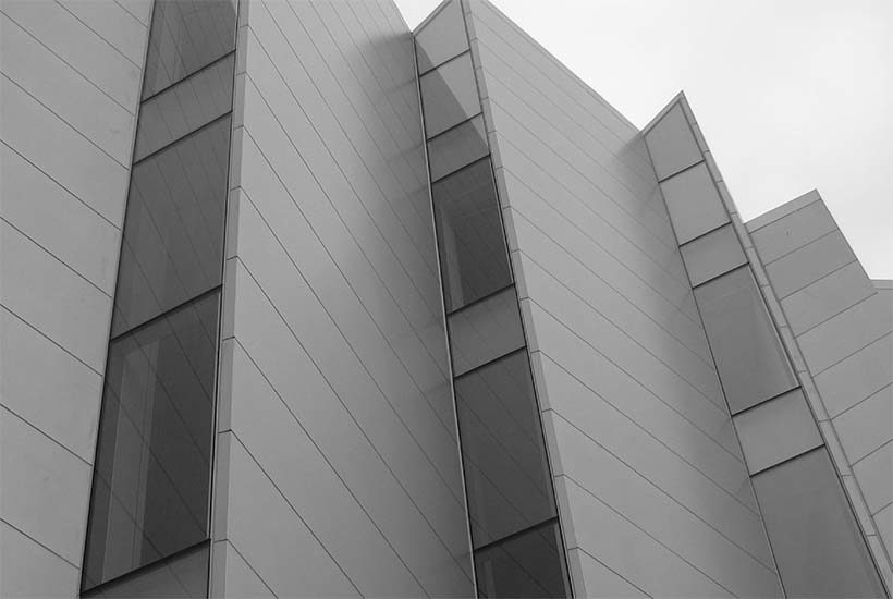 wall on the outside of the Bronx Museum of Arts with modern looking windows