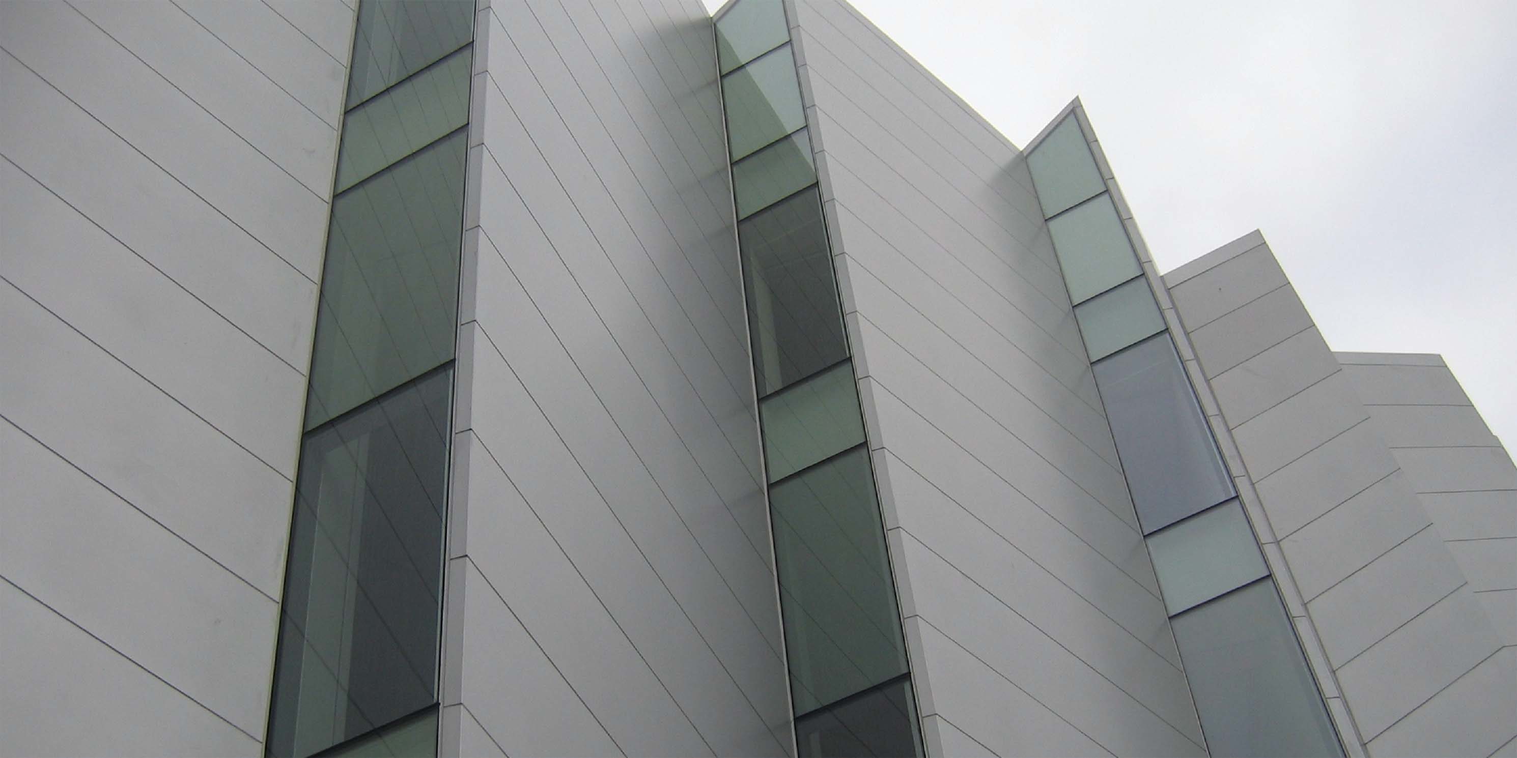 wall on the outside of the Bronx Museum of the Arts with modern looking windows