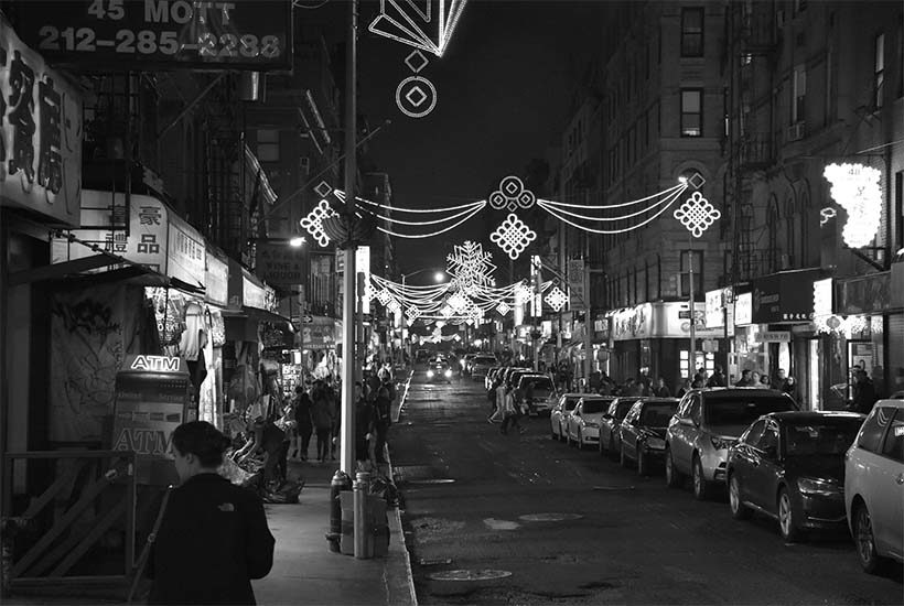 Mott Street at night with festive lights