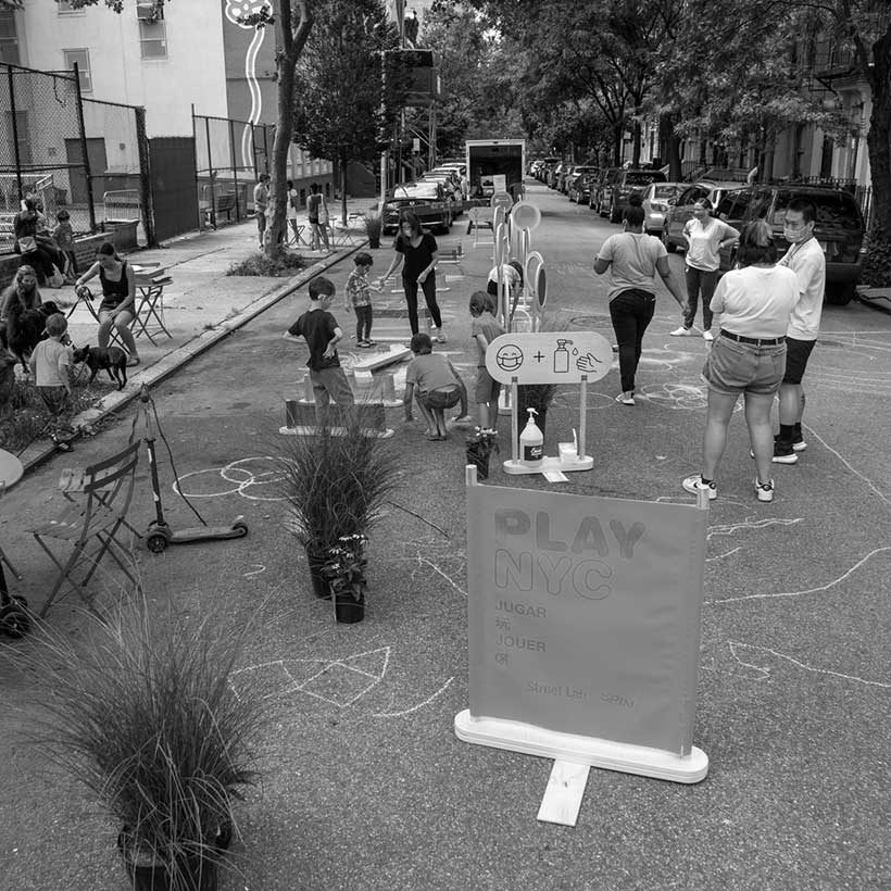 children play on 101st Street in East Harlem during an Open Streets event