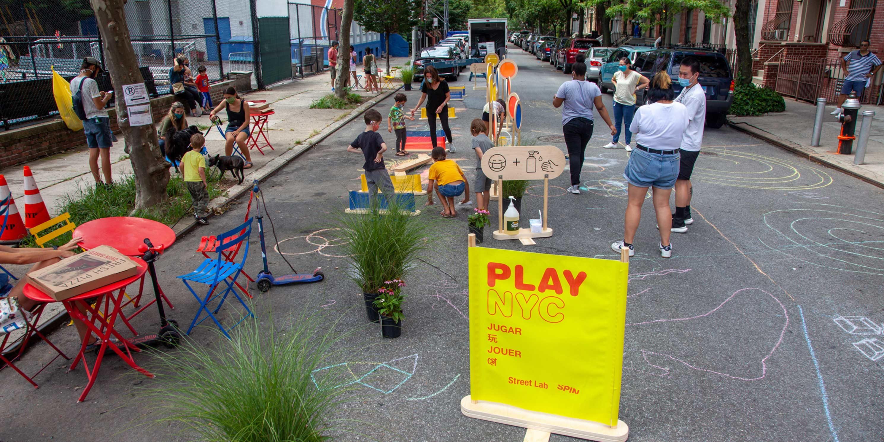 children play on 101st Street in East Harlem during an Open Streets event