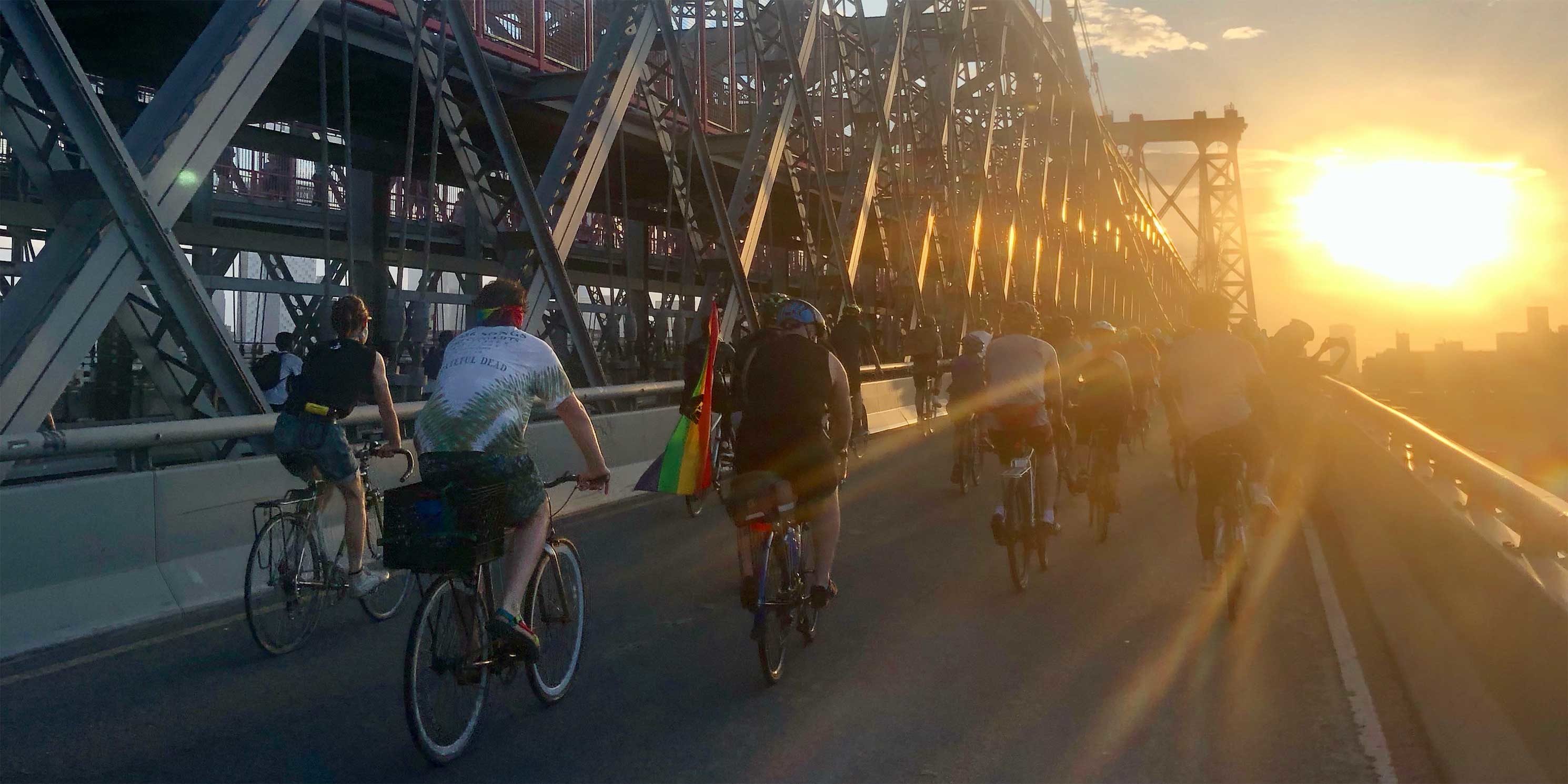 bicyclists ride across bridge in New York City